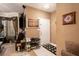 Welcoming living room featuring a modern TV, stylish decor, and a convenient shoe rack by the entrance at 7324 Bridlewood Ct, Jonesboro, GA 30236