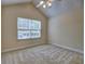 Bright bedroom featuring a large window, neutral carpet and ceiling fan at 106 Vintage Club Cir, Marietta, GA 30066
