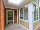 Front entrance of home featuring sidelight windows and brick facade at 106 Vintage Club Cir, Marietta, GA 30066