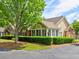 Beautiful front exterior of a single-story home with lush landscaping and a mature shade tree at 106 Vintage Club Cir, Marietta, GA 30066