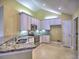 Bright kitchen featuring stainless steel appliances, granite countertops, and white cabinets at 106 Vintage Club Cir, Marietta, GA 30066