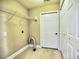 Functional laundry room offering storage with shelving and a closet at 106 Vintage Club Cir, Marietta, GA 30066