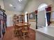 A library with bookshelves and seating arrangements for a comfortable reading experience at 106 Vintage Club Cir, Marietta, GA 30066