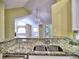View of a living room from kitchen featuring chandelier and view to front of house at 106 Vintage Club Cir, Marietta, GA 30066