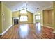 Spacious living room featuring a fireplace, wood floors, and plenty of natural light at 106 Vintage Club Cir, Marietta, GA 30066