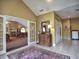 Inviting lobby area with elegant furnishings and tile flooring, adjacent to a dining area at 106 Vintage Club Cir, Marietta, GA 30066