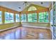 Bright sunroom with large windows offering scenic views and natural light at 106 Vintage Club Cir, Marietta, GA 30066