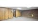 Spacious basement with wood paneled walls, brick fireplace, and ample room for versatile use at 1440 Northwold Dr, Atlanta, GA 30350