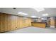 Basement with paneled walls, bar area, and ample space for entertainment or storage at 1440 Northwold Dr, Atlanta, GA 30350