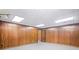 Large finished basement with neutral carpet, wood-paneled walls, and recessed lighting at 1440 Northwold Dr, Atlanta, GA 30350