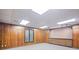 Basement with wood-paneled walls, neutral carpet, and built-in storage at 1440 Northwold Dr, Atlanta, GA 30350