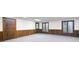 Spacious basement with two windows, a back door, wood trim, and neutral carpet at 1440 Northwold Dr, Atlanta, GA 30350