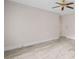 Large bedroom with carpeted floors, ceiling fan, white trim, and a wall AC unit at 1440 Northwold Dr, Atlanta, GA 30350