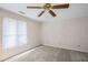 Bedroom features neutral walls, carpet floors, and a ceiling fan, offering a cozy and inviting space at 1440 Northwold Dr, Atlanta, GA 30350