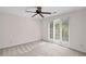 Bedroom features neutral walls, carpet floors, and a ceiling fan, offering a cozy and inviting space at 1440 Northwold Dr, Atlanta, GA 30350