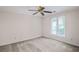 Bedroom features neutral walls, carpet floors, and a ceiling fan, offering a cozy and inviting space at 1440 Northwold Dr, Atlanta, GA 30350