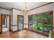 Bright dining area featuring hardwood floors and large windows with picturesque views at 1440 Northwold Dr, Atlanta, GA 30350