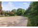 Long driveway leading up to a house surrounded by lush greenery at 1440 Northwold Dr, Atlanta, GA 30350