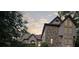 Beautiful stone and stucco exterior with large windows under an overcast sky at 1440 Northwold Dr, Atlanta, GA 30350