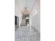 Grand foyer features marble floors, winding staircase, and elegant chandelier at 1440 Northwold Dr, Atlanta, GA 30350