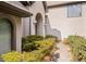 Close up of front door showing arched entryway with stone exterior and side lamps at 1440 Northwold Dr, Atlanta, GA 30350
