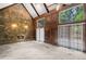 Spacious living room with a stone fireplace, vaulted ceilings, and walls of windows at 1440 Northwold Dr, Atlanta, GA 30350