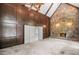 Inviting living room showcases stone fireplace, wood paneling, vaulted ceilings, and cozy atmosphere at 1440 Northwold Dr, Atlanta, GA 30350