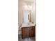 Traditional powder room with patterned wallpaper, dark wood vanity, and marble floors at 1440 Northwold Dr, Atlanta, GA 30350