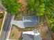Aerial view showing a home's roof, driveway, sidewalk and lawn with adjacent street and other residences at 1576 Hawthorne Se Ave, Smyrna, GA 30080