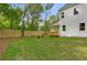Spacious backyard features a wooden fence, green grass, and a covered deck, perfect for outdoor relaxation at 1576 Hawthorne Se Ave, Smyrna, GA 30080