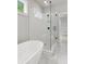 Bathroom showcases a clear glass shower and a freestanding tub in a sleek, modern design at 1576 Hawthorne Se Ave, Smyrna, GA 30080