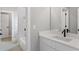 Bathroom featuring a white vanity, large mirror, and subway tiled shower at 1576 Hawthorne Se Ave, Smyrna, GA 30080