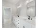 Bathroom features double sinks and a tile shower, combining modern elegance with practical design at 1576 Hawthorne Se Ave, Smyrna, GA 30080