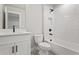 Modern bathroom with white subway tile, black fixtures, and a stylish vanity for a sleek, contemporary feel at 1576 Hawthorne Se Ave, Smyrna, GA 30080
