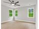 Bright bedroom features large windows and light hardwood floors, creating a serene and inviting space at 1576 Hawthorne Se Ave, Smyrna, GA 30080