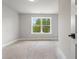 Sunlit bedroom featuring a large window with a view, ideal for relaxation and rest, ready for your customization at 1576 Hawthorne Se Ave, Smyrna, GA 30080