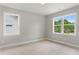 Bedroom with two windows offering views of the surrounding neighborhood at 1576 Hawthorne Se Ave, Smyrna, GA 30080