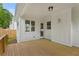 Cozy deck for outdoor living and entertaining, with a view of the backyard and access to the home at 1576 Hawthorne Se Ave, Smyrna, GA 30080