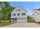 Charming two-story home with white siding, gray shutters, and a well-manicured lawn at 1576 Hawthorne Se Ave, Smyrna, GA 30080