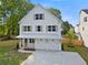 Charming two-story home with white siding, gray shutters, and a well-manicured lawn at 1576 Hawthorne Se Ave, Smyrna, GA 30080