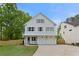 Charming two-story home with white siding, gray shutters, and a well-manicured lawn at 1576 Hawthorne Se Ave, Smyrna, GA 30080
