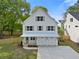 Charming two-story home with white siding, gray shutters, and a well-manicured lawn at 1576 Hawthorne Se Ave, Smyrna, GA 30080