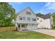 Charming two-story home with white siding, gray shutters, and a well-manicured lawn at 1576 Hawthorne Se Ave, Smyrna, GA 30080
