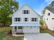 Charming two-story home with white siding, gray shutters, and a well-manicured lawn at 1576 Hawthorne Se Ave, Smyrna, GA 30080