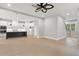 Spacious kitchen featuring a dark island with white countertops, stainless steel appliances and hardwood floors at 1576 Hawthorne Se Ave, Smyrna, GA 30080