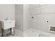 Well-lit laundry room featuring a utility sink and patterned flooring at 1576 Hawthorne Se Ave, Smyrna, GA 30080