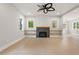 Bright living room with hardwood floors, fireplace, and built-in shelving at 1576 Hawthorne Se Ave, Smyrna, GA 30080