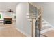 Elegant staircase with hardwood treads, modern railings, and an open view of the living area at 1576 Hawthorne Se Ave, Smyrna, GA 30080
