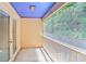 Cozy balcony with screen, white railing, and door, perfect for enjoying the outdoors at 59 Saint Claire Ne Ln, Atlanta, GA 30324