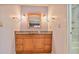 Bathroom features a vanity with granite counters and tiled shower/tub at 59 Saint Claire Ne Ln, Atlanta, GA 30324